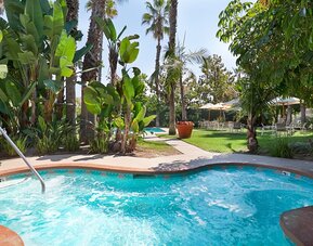 Refreshing outdoor pool at Embassy Suites By Hilton Brea North Orange County.