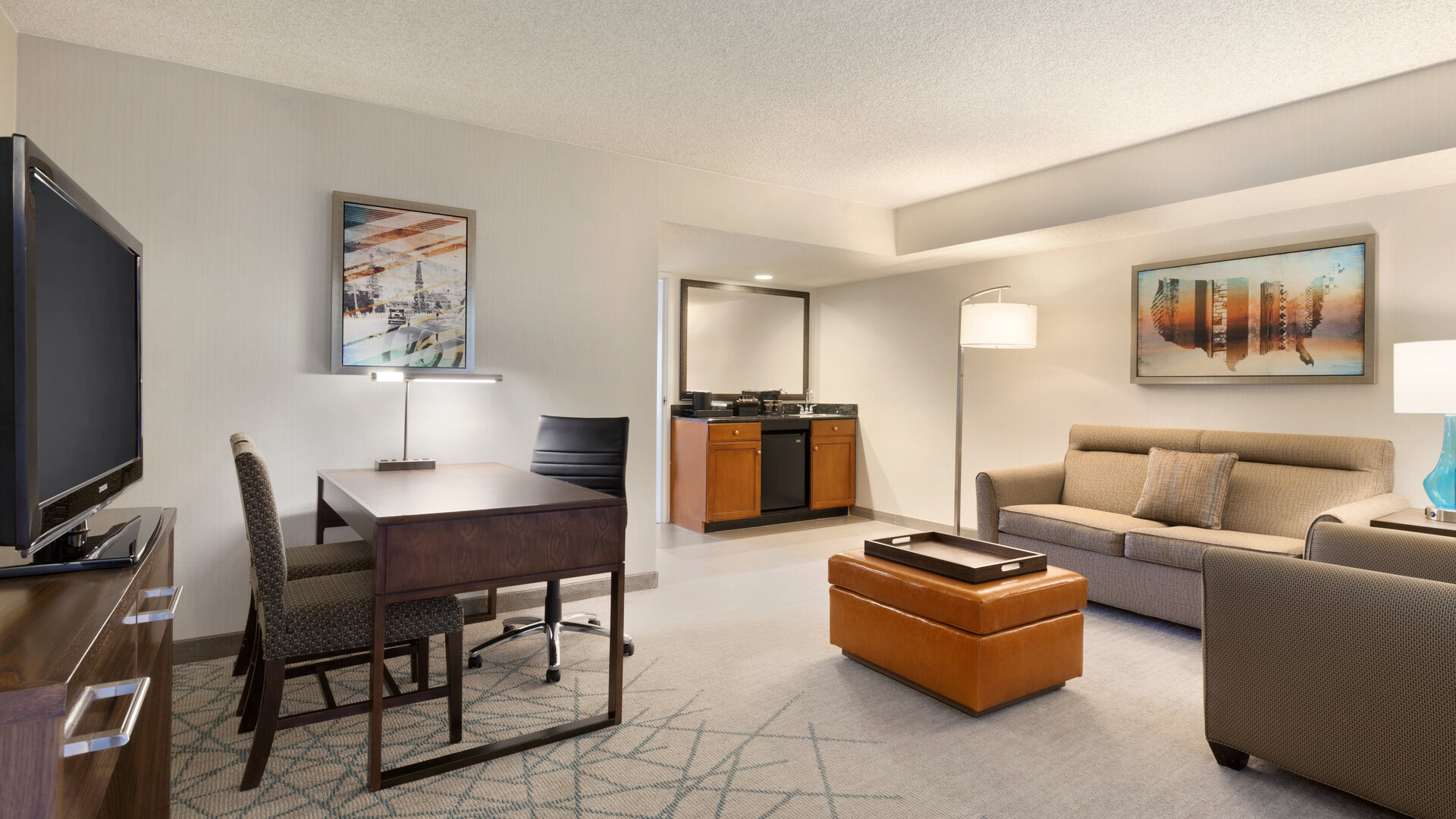 Living area inside day use room at Embassy Suites By Hilton Brea North Orange County.