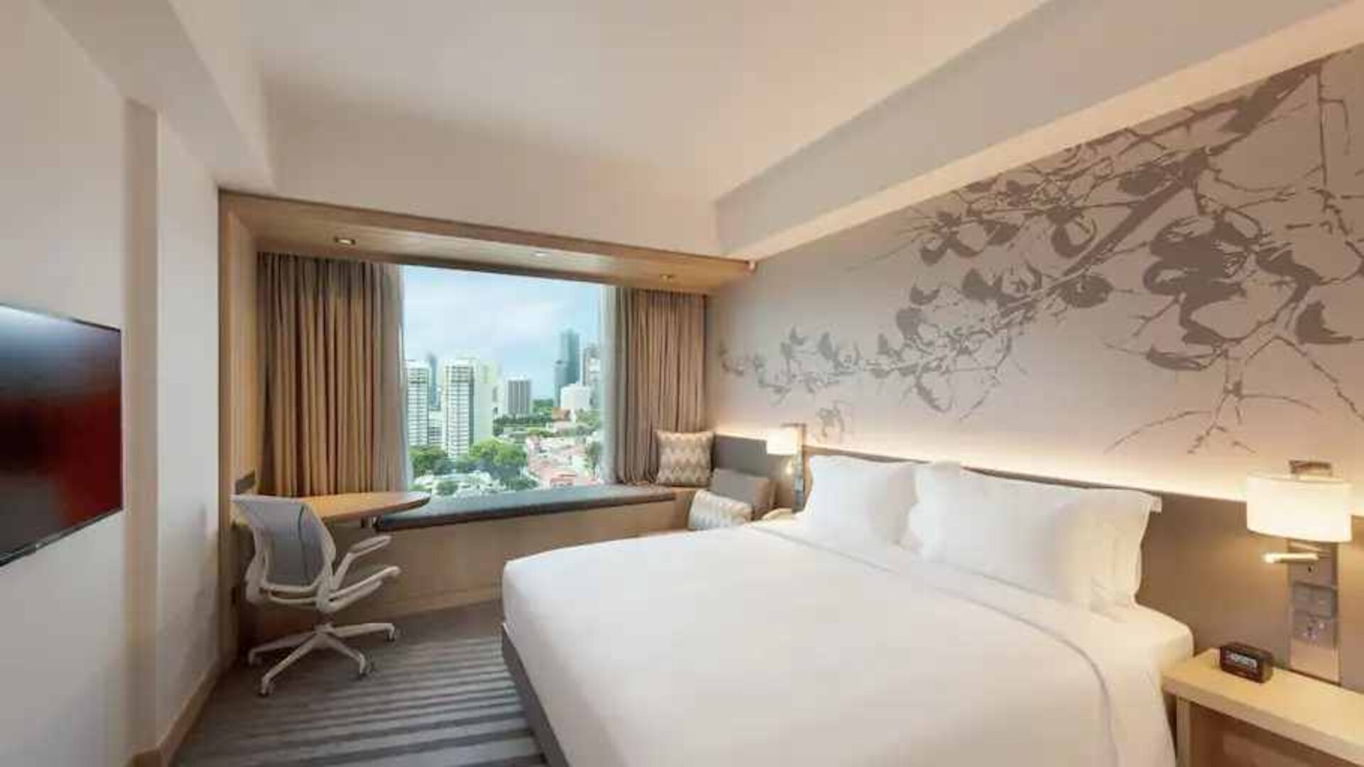 King size bed in a deluxe room with great city view at the Hilton Garden Inn Singapore Serangoon.