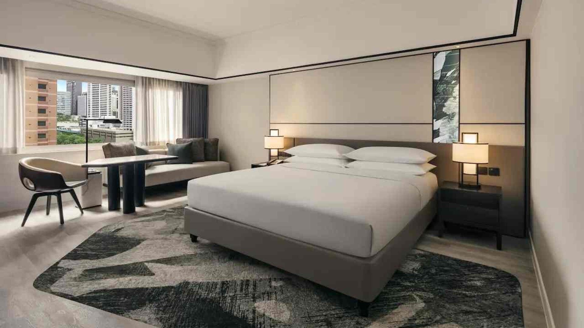 King size bed in a deluxe room with great city view at the Hilton Singapore Orchard.