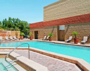 Relaxing outdoor pool area with at the Hilton Orlando-Altamonte Springs.