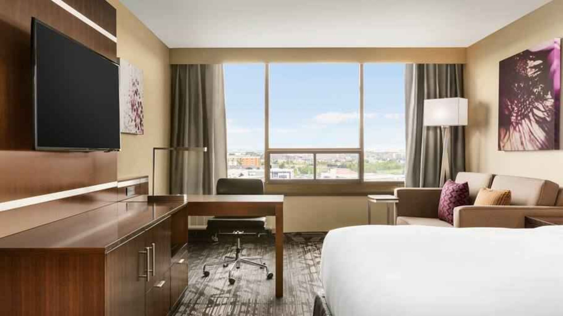 King size bed in a king deluxe room at the Double Tree Toronto Airport West.