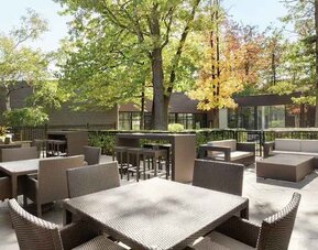 Beautiful workspace with plants and comfortable seating at the Double Tree Toronto Airport West.