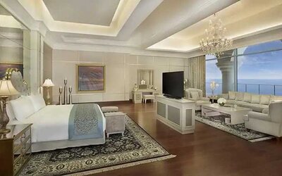 Deluxe suite with separate living room and sea view at the Waldorf Astoria Dubai Palm Jumeirah.