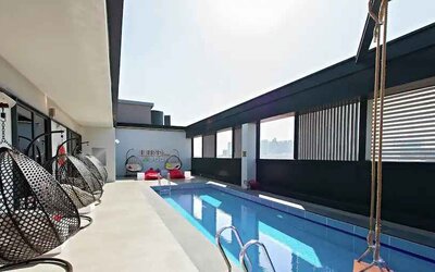 Relaxing rooftop with pool at the Hampton by Hilton Dubai Al Seef.