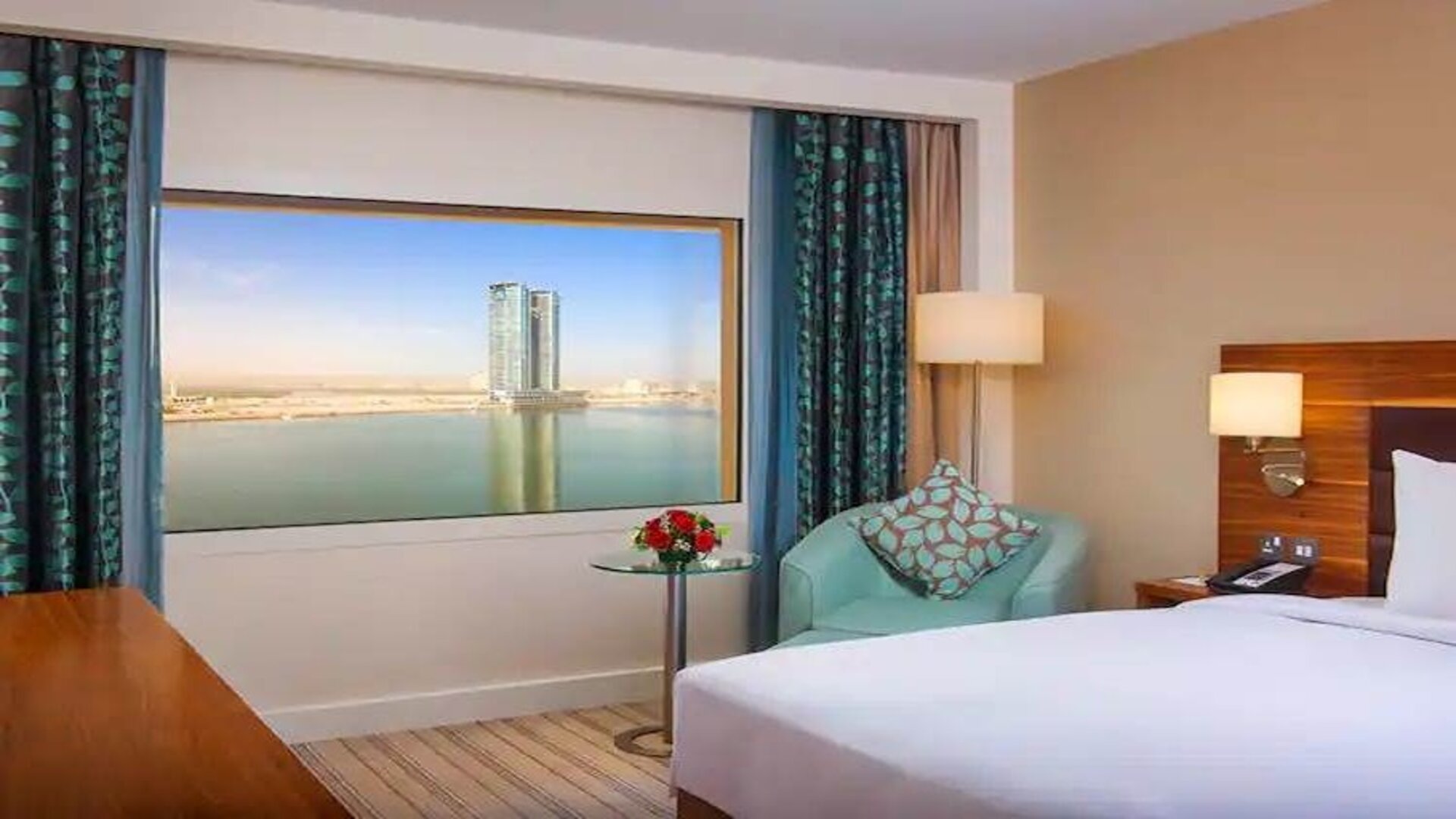 Bright queen room with amazing creek view at the Hilton Ras Al Khaimah Beach Resort.