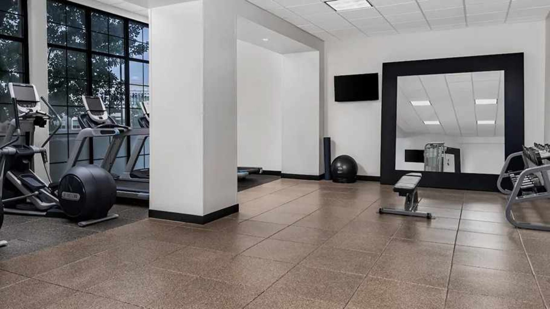 Equipped fitness center at Embassy Suites by Hilton Nashville Airport.