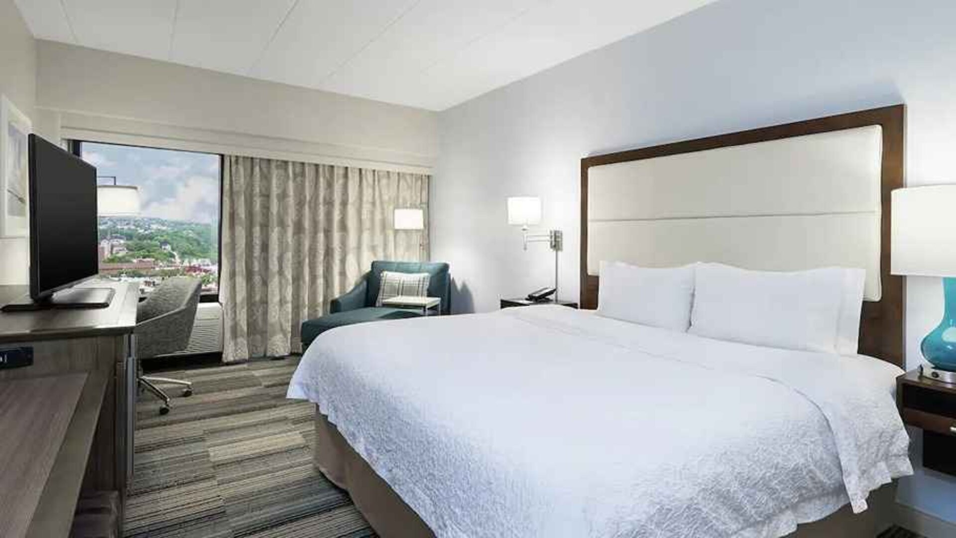 Delux king bed with work desk at Hampton Inn Pittsburgh University/Medical Center.