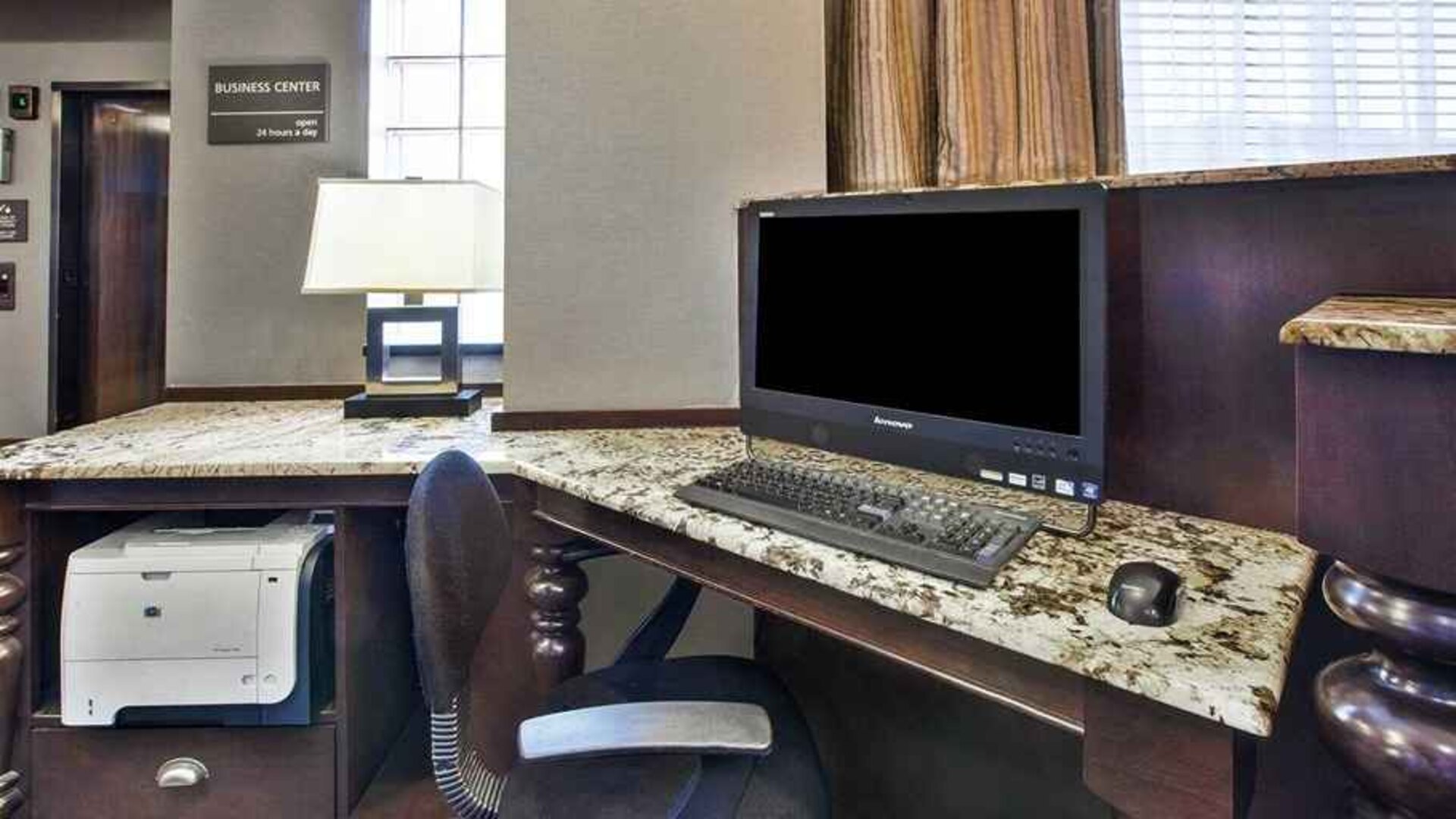 Equipped work station for coworking or individual work Delux king bed with work desk at Hampton Inn Pittsburgh University/Medical Center.