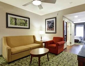 Spacious living room in a king guestroom at the Hilton Garden Inn Fort Collins.