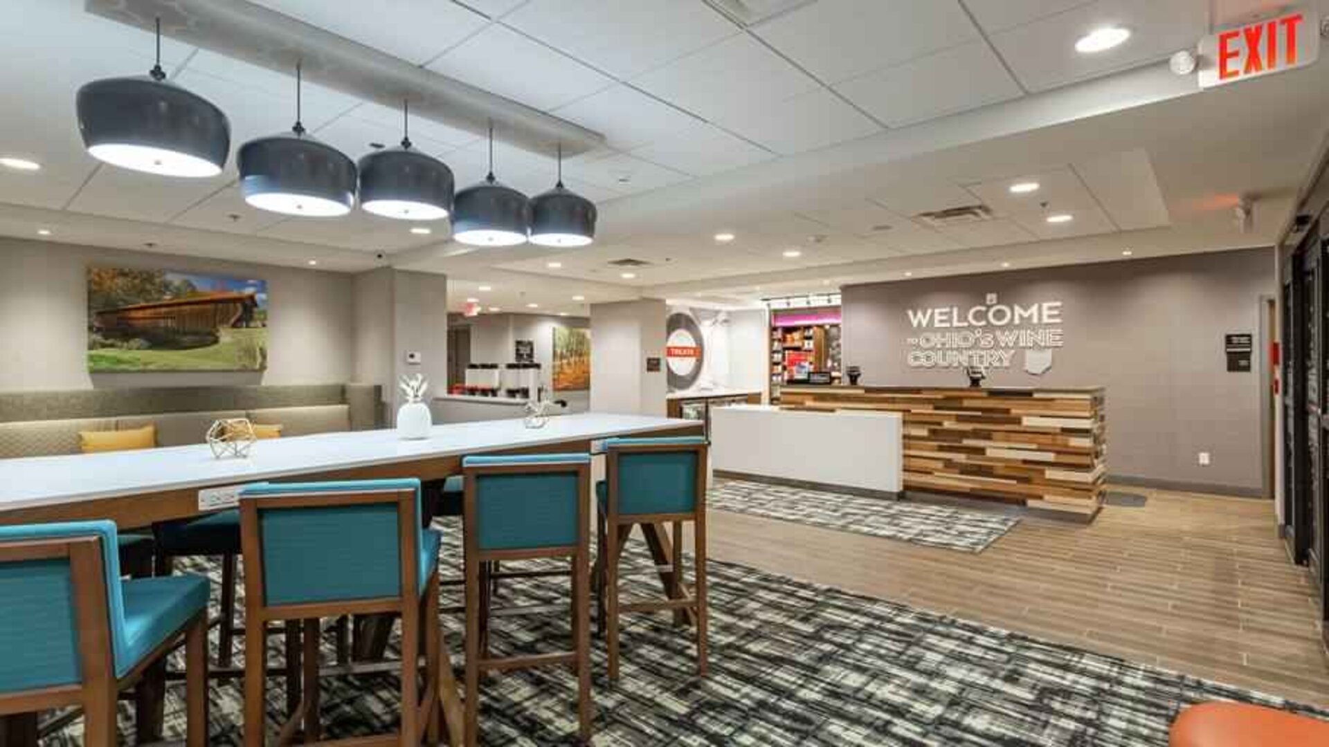 Spacious and comfortable lobby area perfect as workspace at the Hampton Inn Madison, OH.