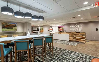 Spacious and comfortable lobby area perfect as workspace at the Hampton Inn Madison, OH.