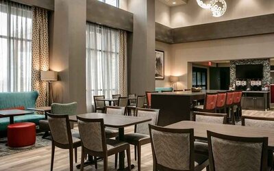 Well-lit, spacious lounge and work area for coworking at Hampton Inn Wichita Northwest.