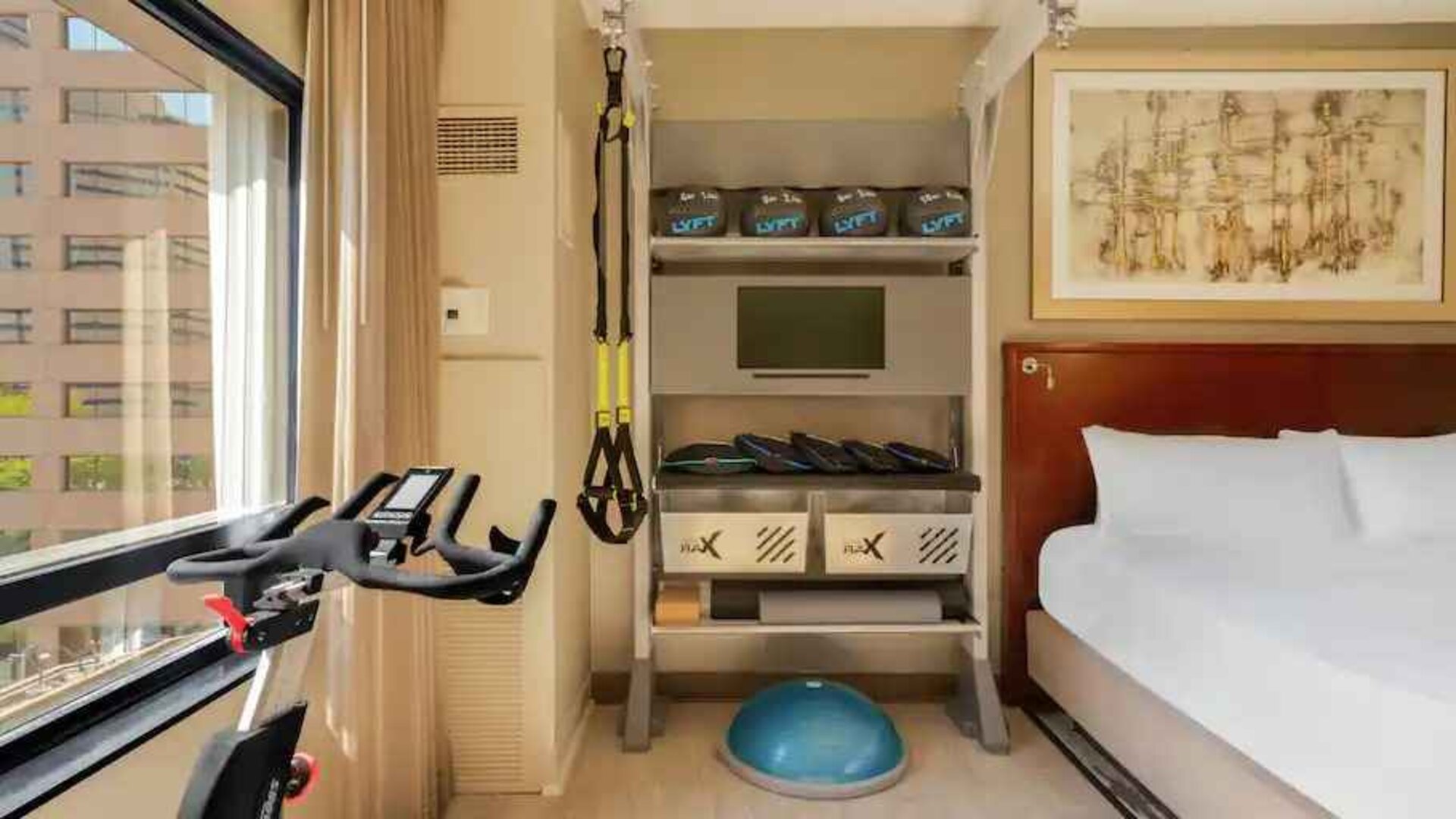 Guestroom with fitness equipment at the Hilton Denver City Center.