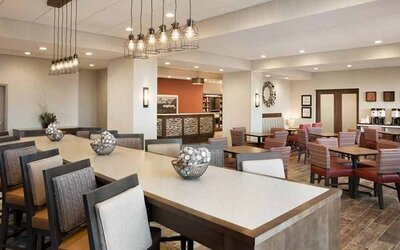 Bright-lit lobby and coworking space at Hampton Inn By Hilton, Salt Lake City Cottonwood.