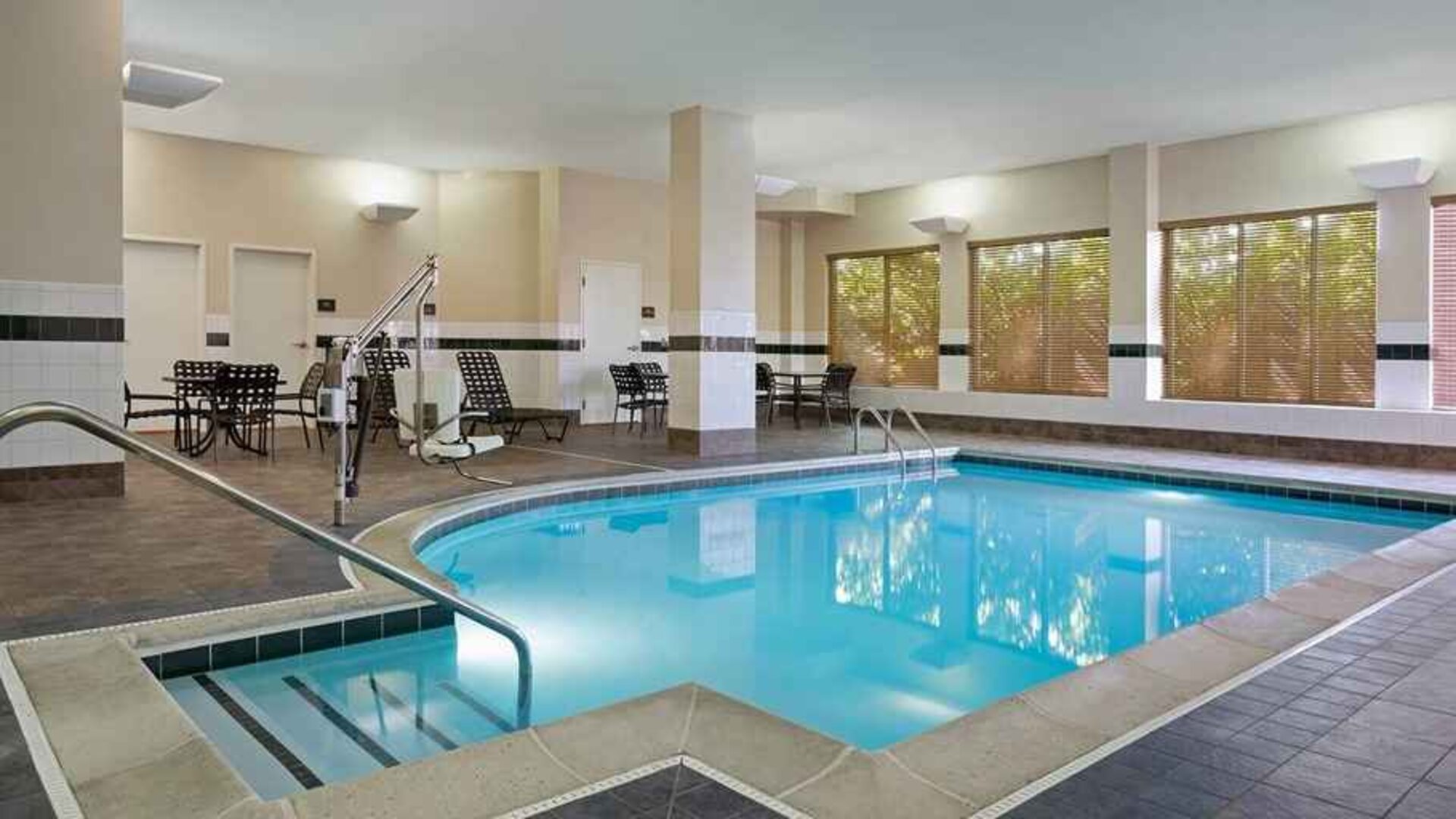 Lovely indoor pool with seating area at Hilton Garden Inn Chicago/Midway Airport.