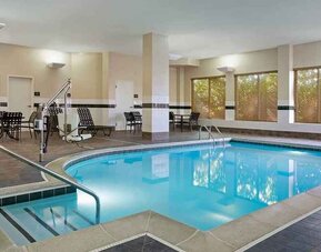 Lovely indoor pool with seating area at Hilton Garden Inn Chicago/Midway Airport.