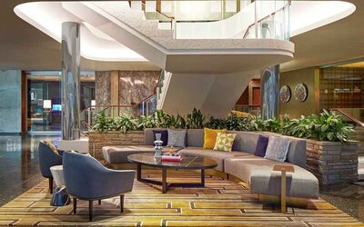 Elegant courtyard lobby perfect as workspace at the Statler Dallas, Curio Collection by Hilton.