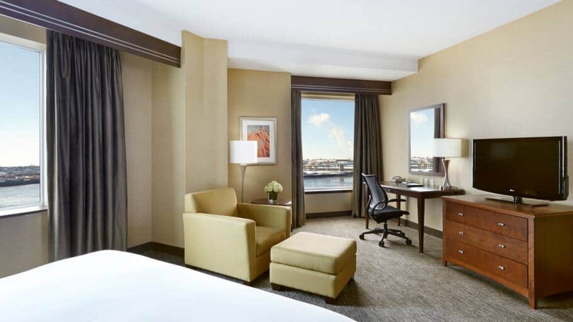 Day use room with work desk and lounge area at the Hilton Saint John.