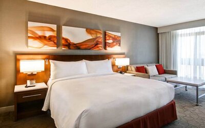 Day use room with lounge area and private bathroom at Hilton Mississauga Meadowvale.