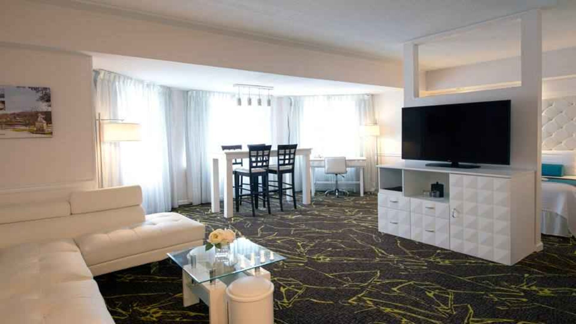 Spacious and comfortable living room in a king suite at the The Roslyn, Tapestry Collection by Hilton.