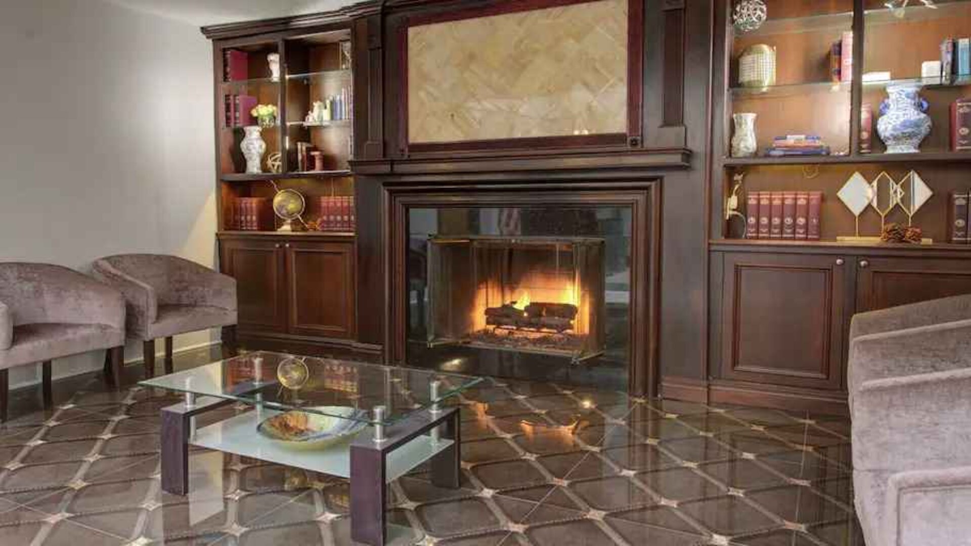 Beautiful library area with fireplace perfect as workspace at the The Roslyn, Tapestry Collection by Hilton.