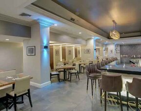 Elegant dining area perfect as workspace at the The Roslyn, Tapestry Collection by Hilton.