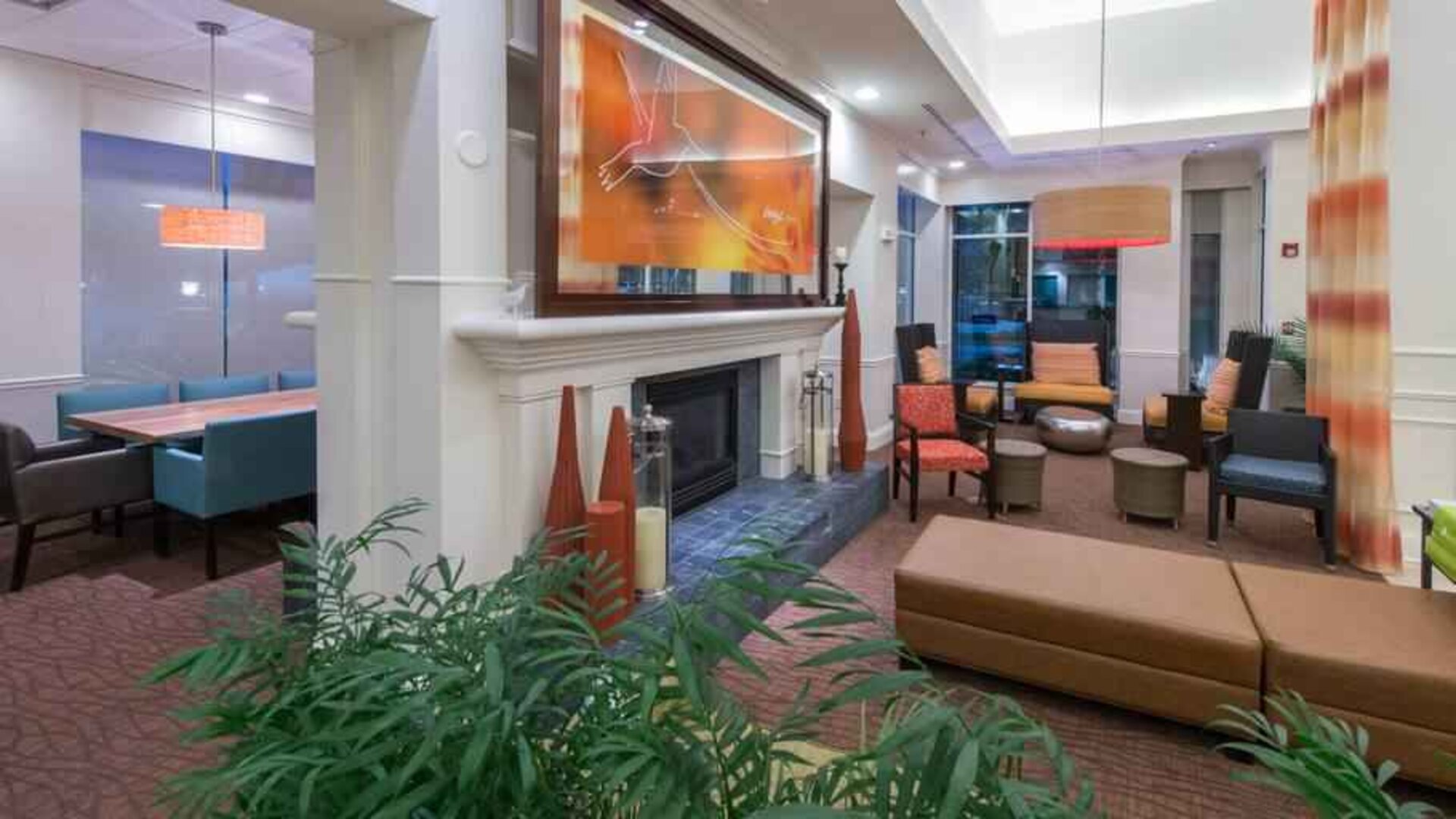 Elegant lobby area with fireplace perfect as workspace at the Hilton Garden Inn Tallahassee Central.