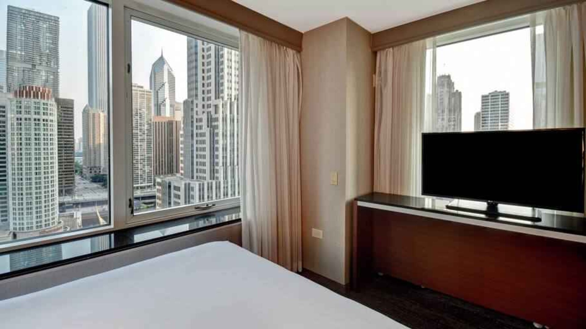 King guestroom with city view at the Embassy Suites by Hilton Chicago Magnificent Mile.