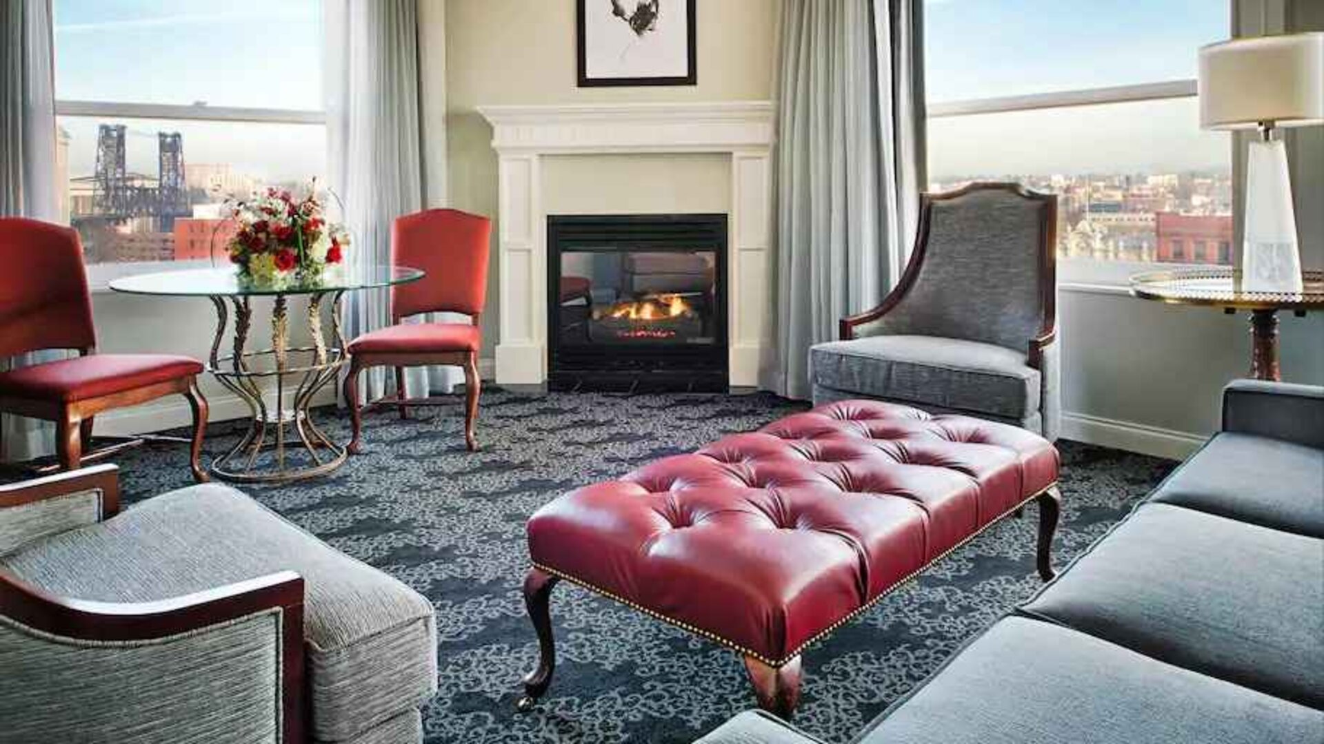 Bright and comfortable presidential suite with sofas and fireplace at the Embassy Suites by Hilton Portland-Downtown.