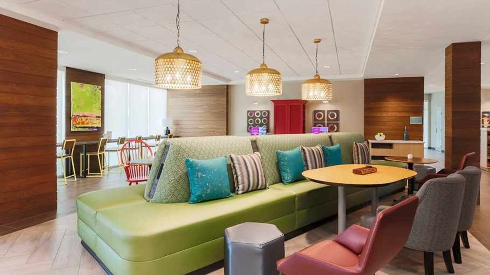 funky, colorful, and well-lit lobby and coworking space at Home2 Suites by Hilton West Sacramento.