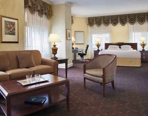 Spacious family room with king size bed and working station at The Drake.