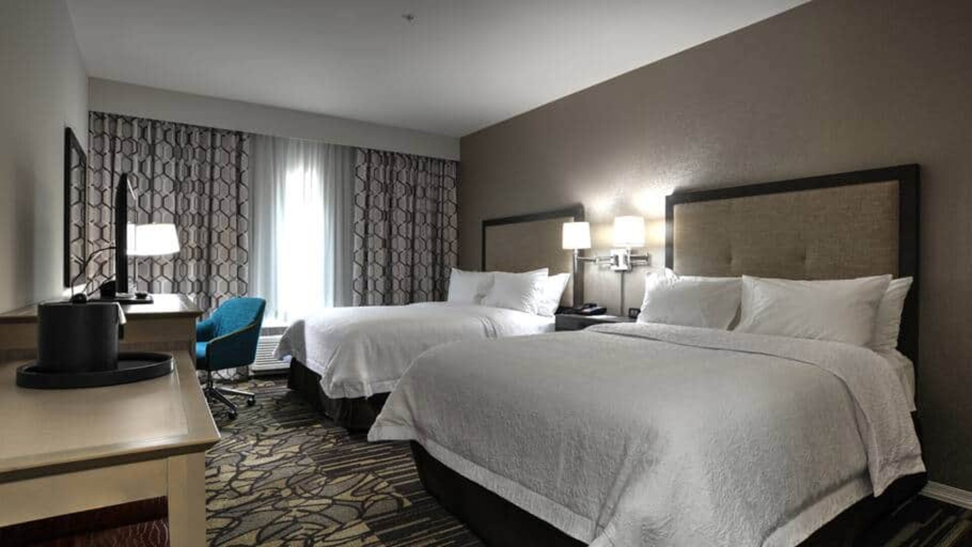 2 queen beds in suite with desk at the Hampton inn & Suites Ardmore.