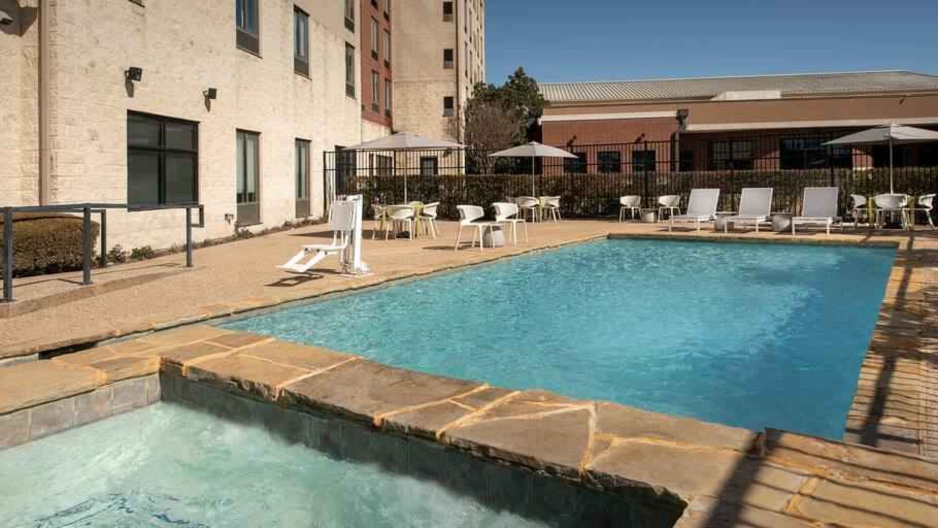 Relaxing outdoor pool area at the Hilton Garden Inn Dallas/Duncanville.
