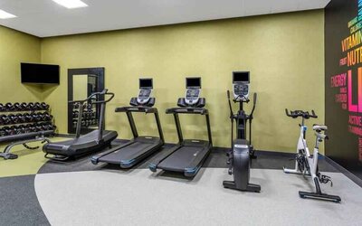 Fitness center with treadmills and weights at the Hilton Garden Inn Hays.