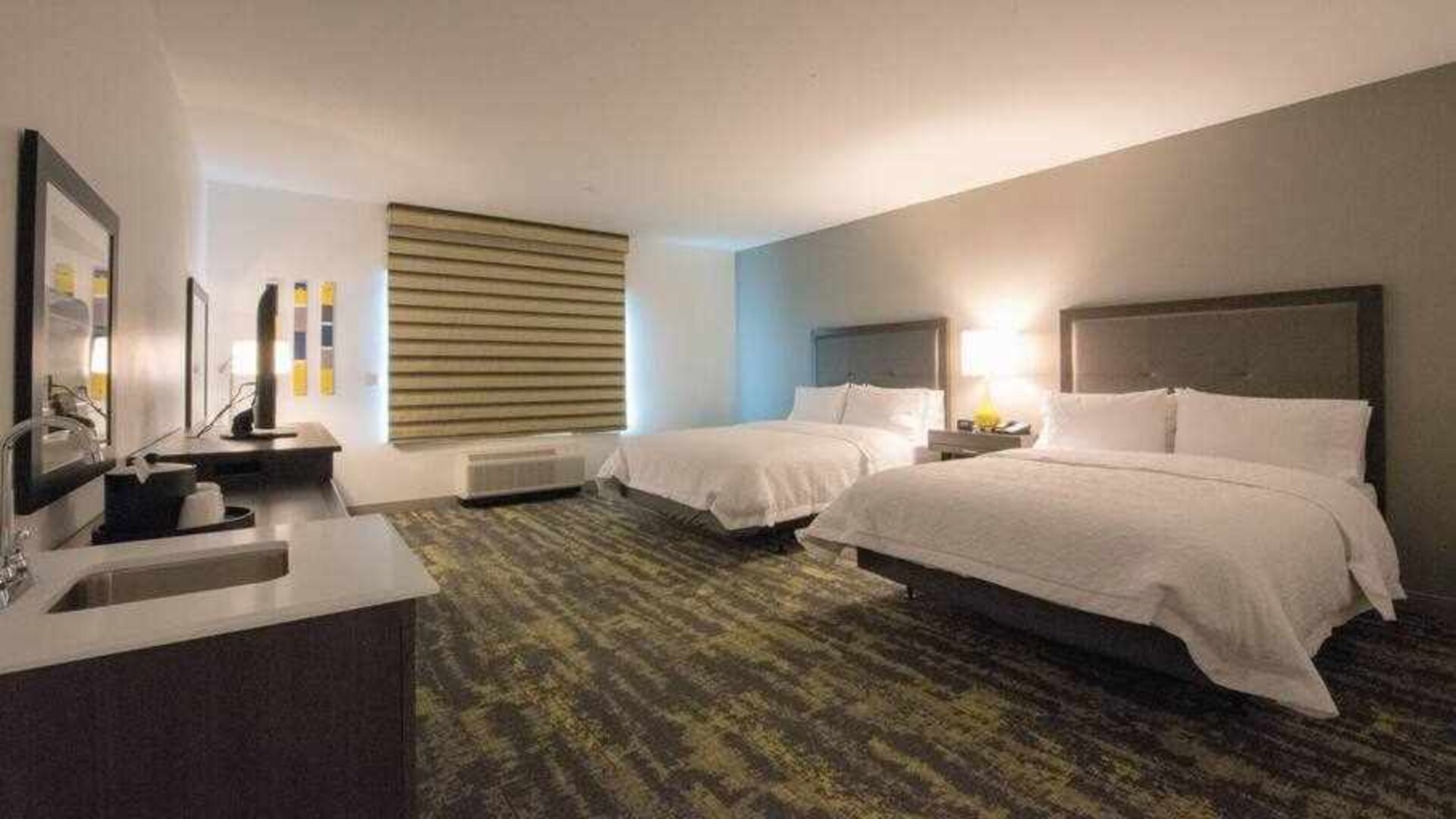 Double queen bedroom at the Hampton Inn & Suites by Hilton-Irvine/Orange County Airport.