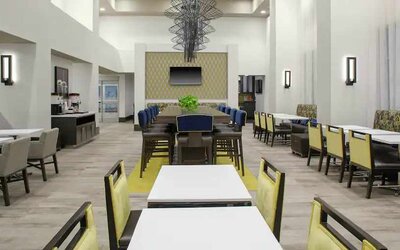 Comfortable dining area perfect as workspace at the Hampton Inn & Suites by Hilton-Irvine/Orange County Airport.