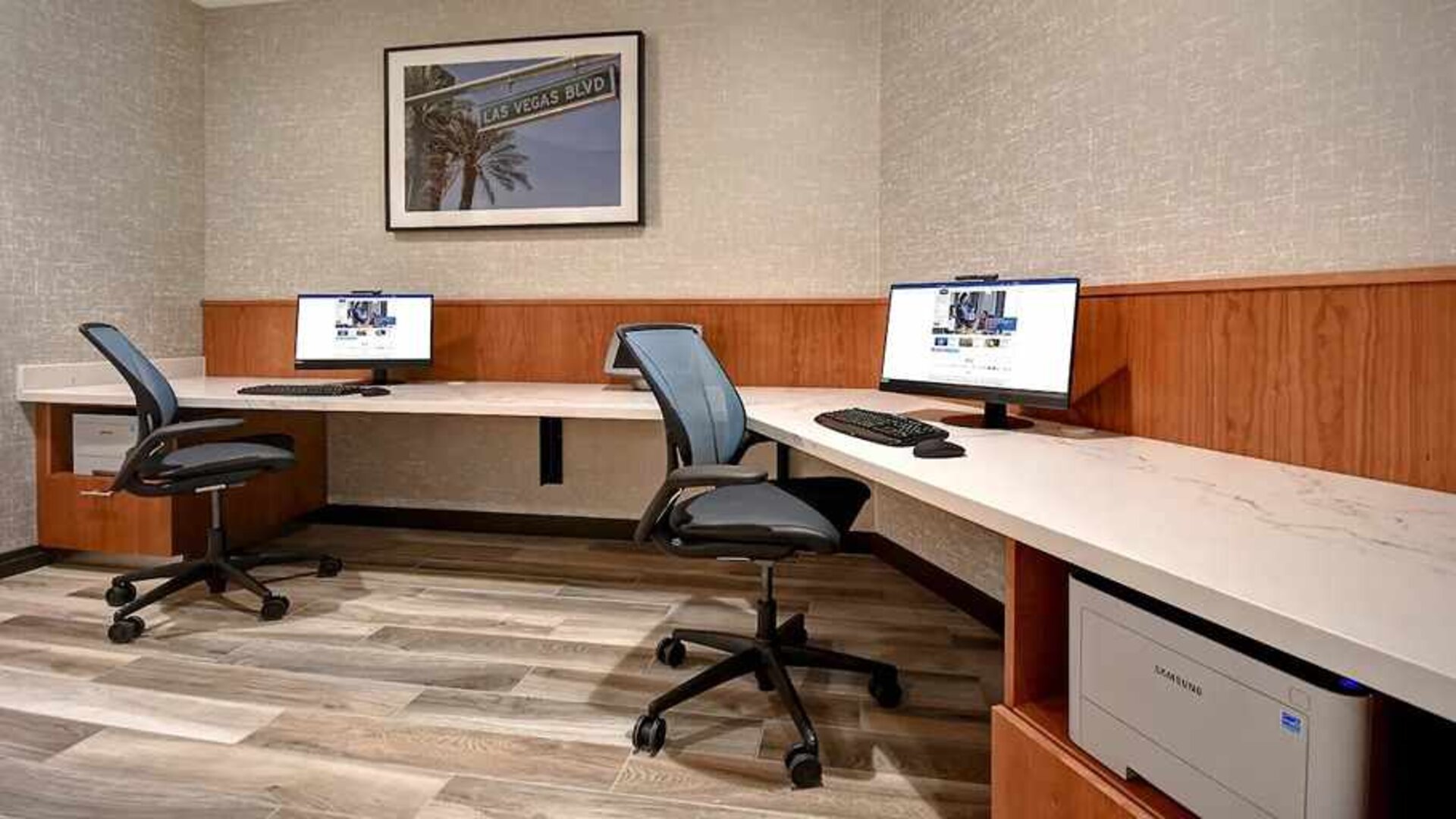 dedicated business center with PC, internet, printer, and work desk at Home2 Suites by Hilton Las Vegas Convention Center.