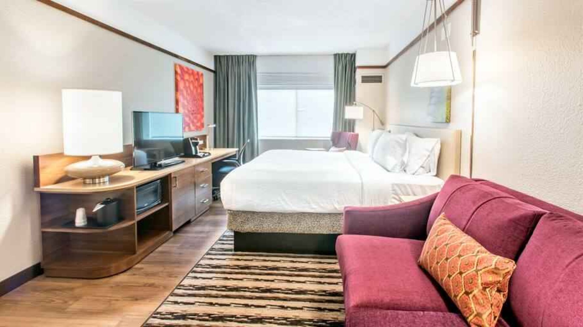 Bright and comfortable king guestroom at the Hilton Garden Inn Minneapolis Airport Mall of America.