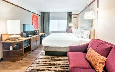 Bright and comfortable king guestroom at the Hilton Garden Inn Minneapolis Airport Mall of America.