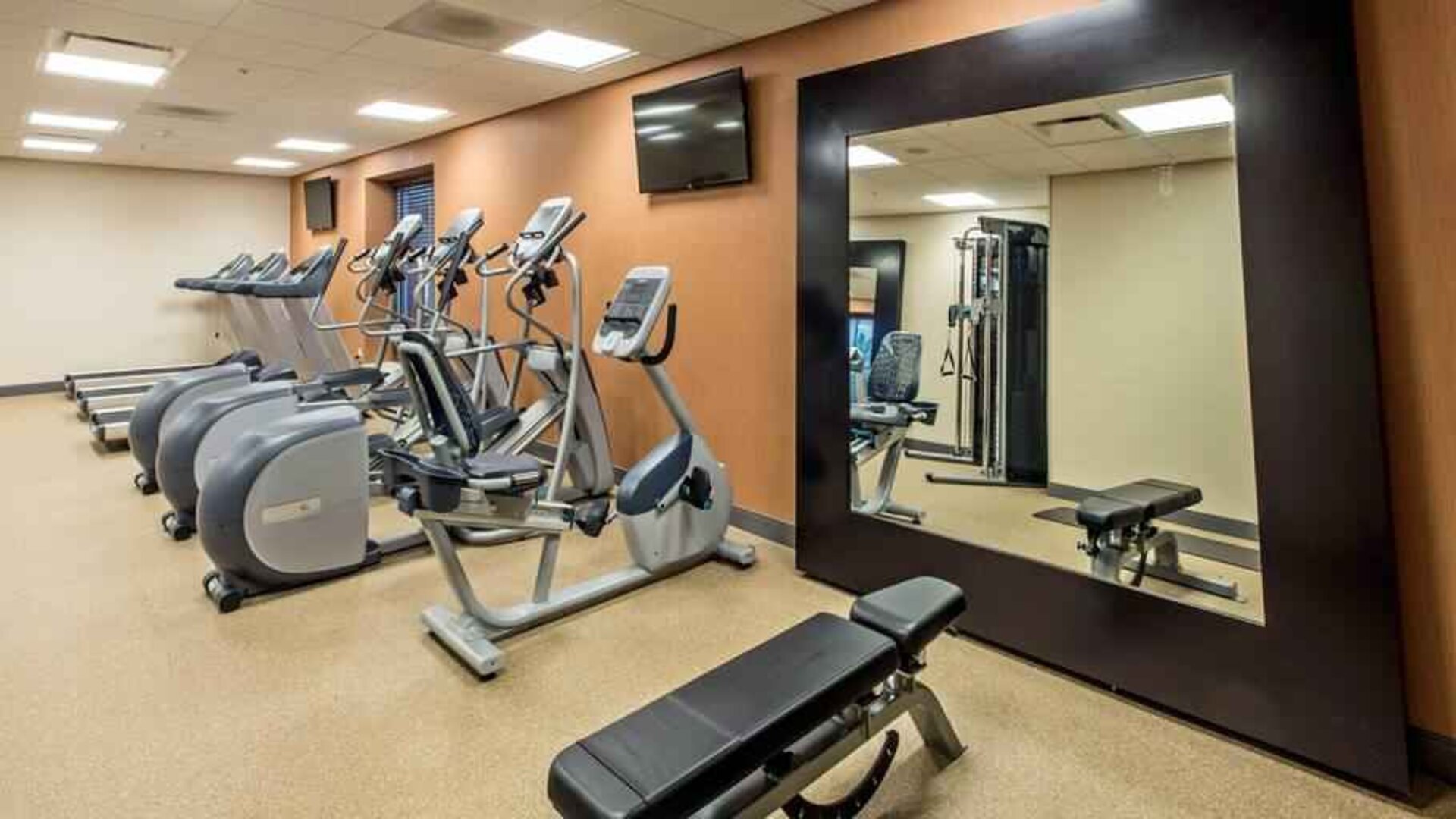 Fitness center with treadmills and mirror at the Hilton Garden Inn Minneapolis Airport Mall of America.