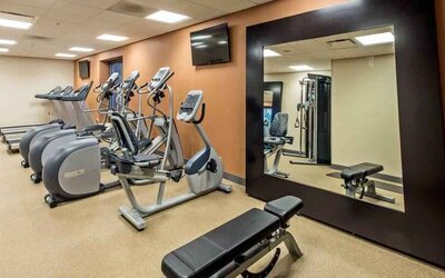 Fitness center with treadmills and mirror at the Hilton Garden Inn Minneapolis Airport Mall of America.