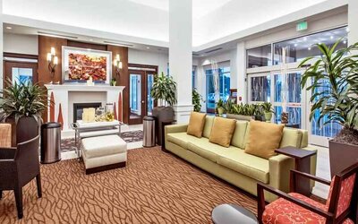 Workspace with lounges in a hotel lobby at the Hilton Garden Inn Minneapolis Airport Mall of America.
