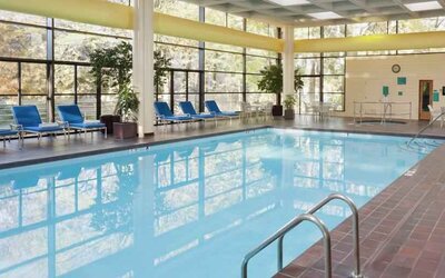 Relaxing indoor pool with lounges at the DoubleTree by Hilton Kansas City - Overland Park.