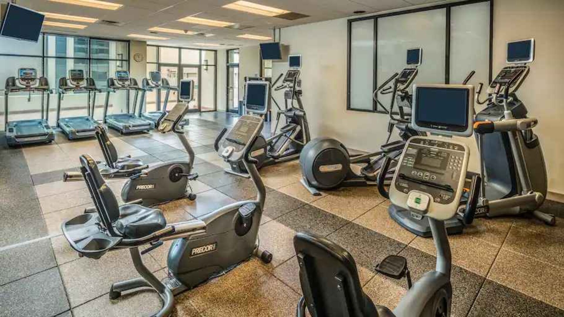 Fitness center with treadmills and machines at the Hilton Salt Lake City Center.