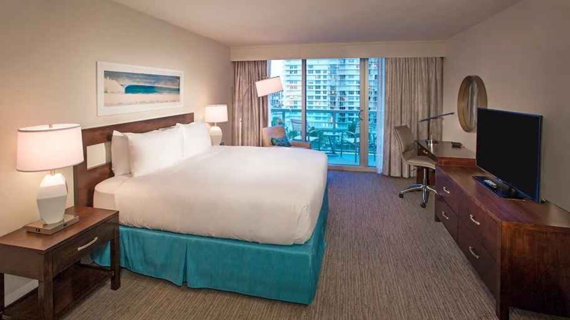 spacious king room with TV and business desk at DoubleTree Resort by Hilton Hollywood Beach.