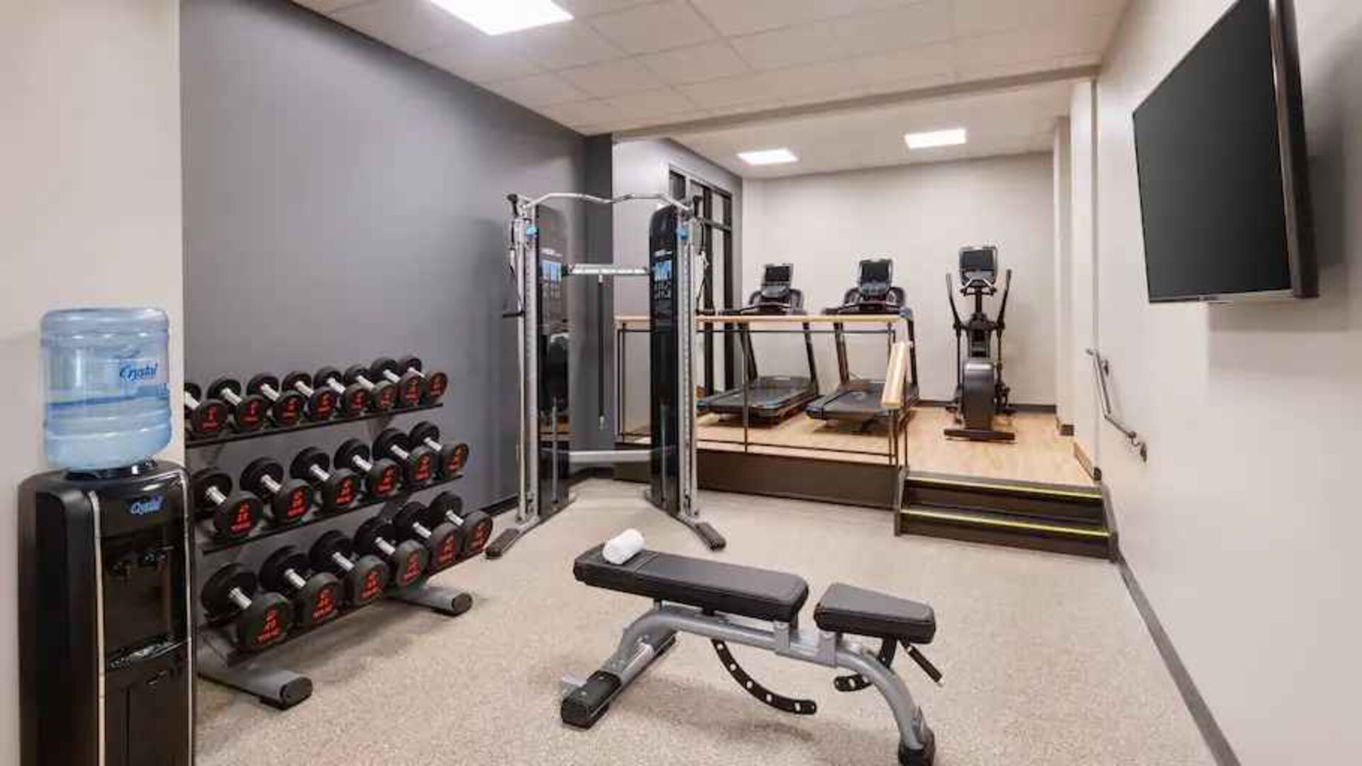 Weights and treadmills at the fitness center of the Embassy Suites by Hilton Tysons Corner.