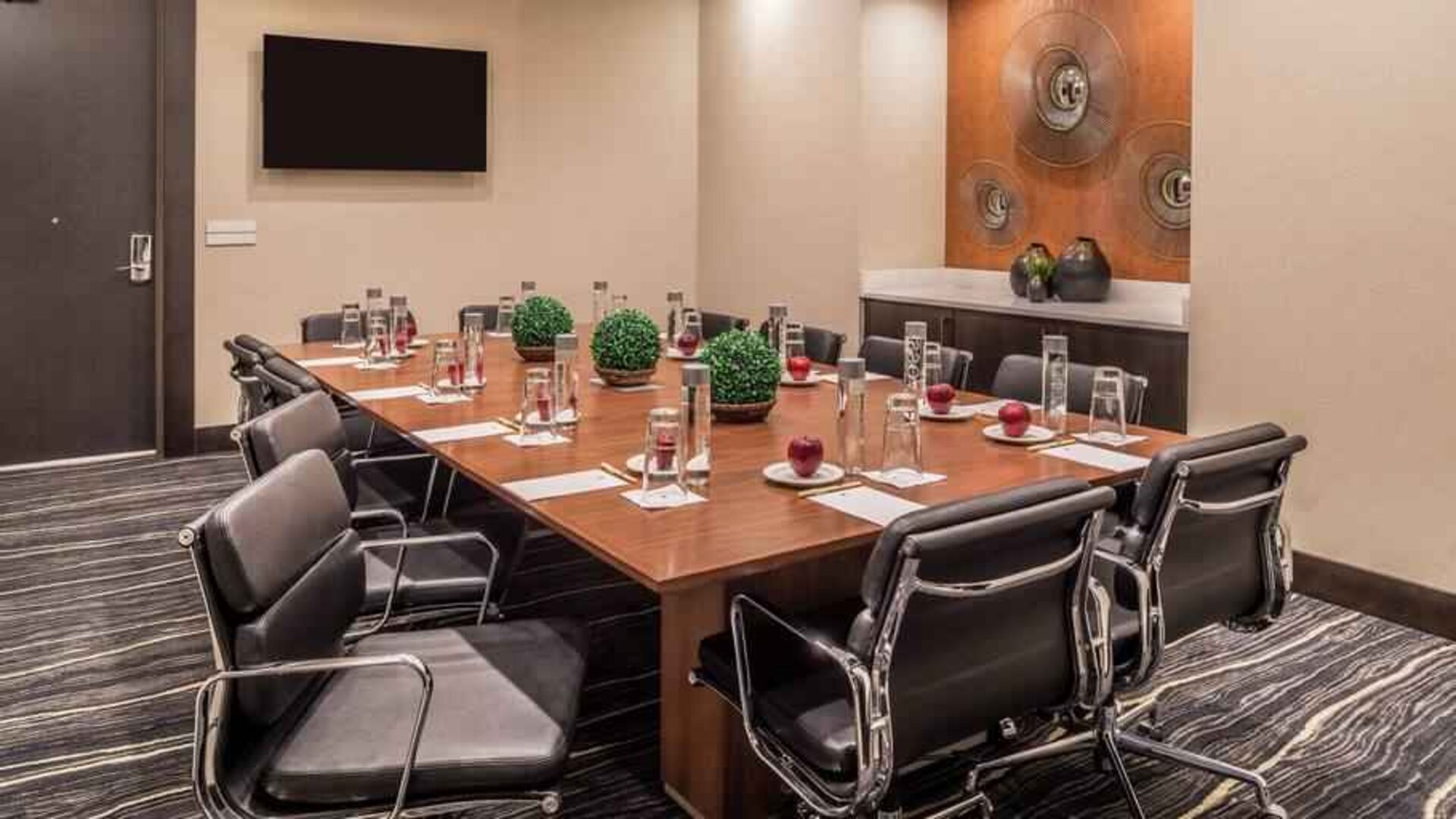 Small meeting room with conference table at the DoubleTree by Hilton Lafayette East.
