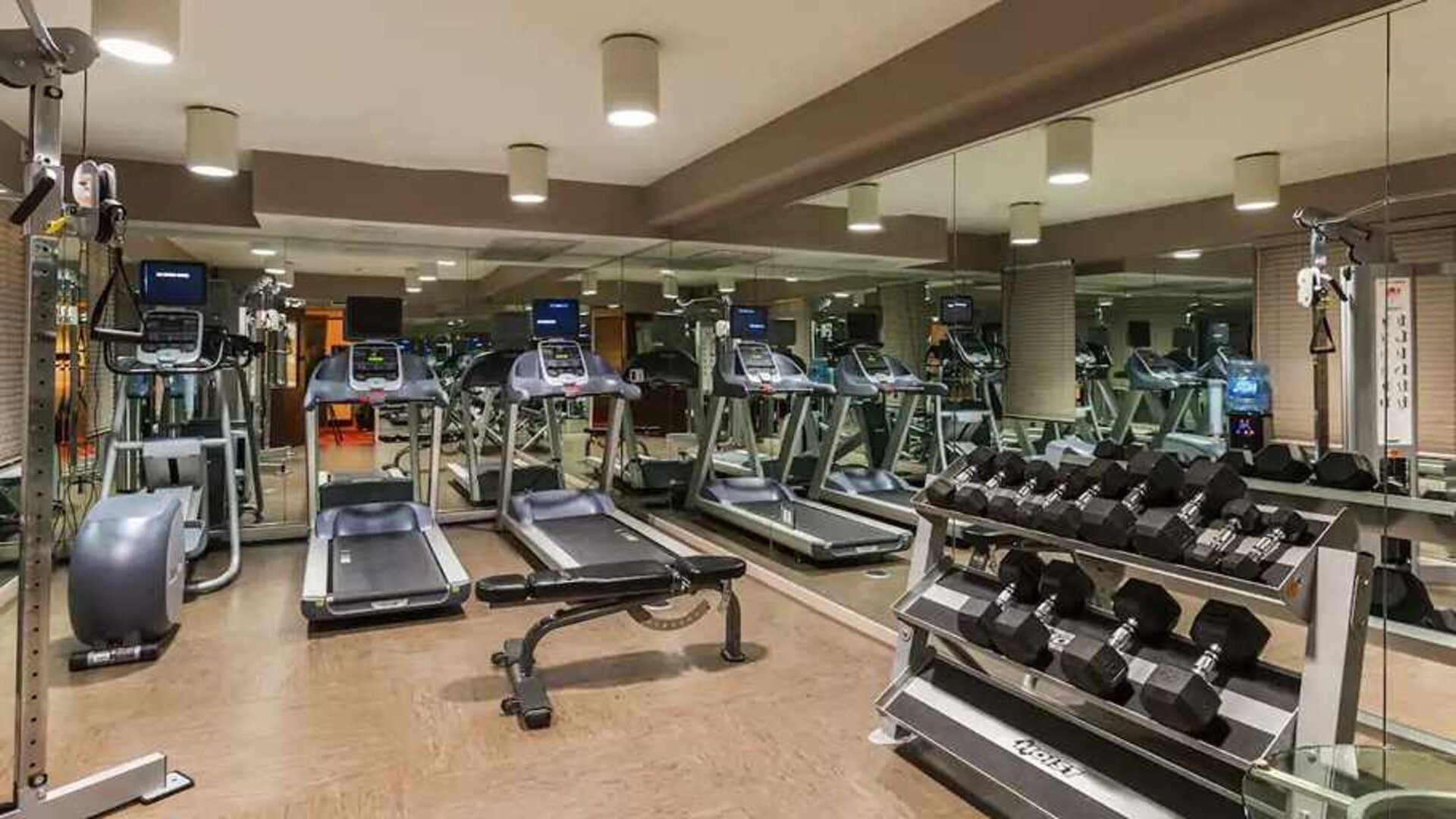Well-equipped fitness center at The Sam Houston, Curio Collection by Hilton.