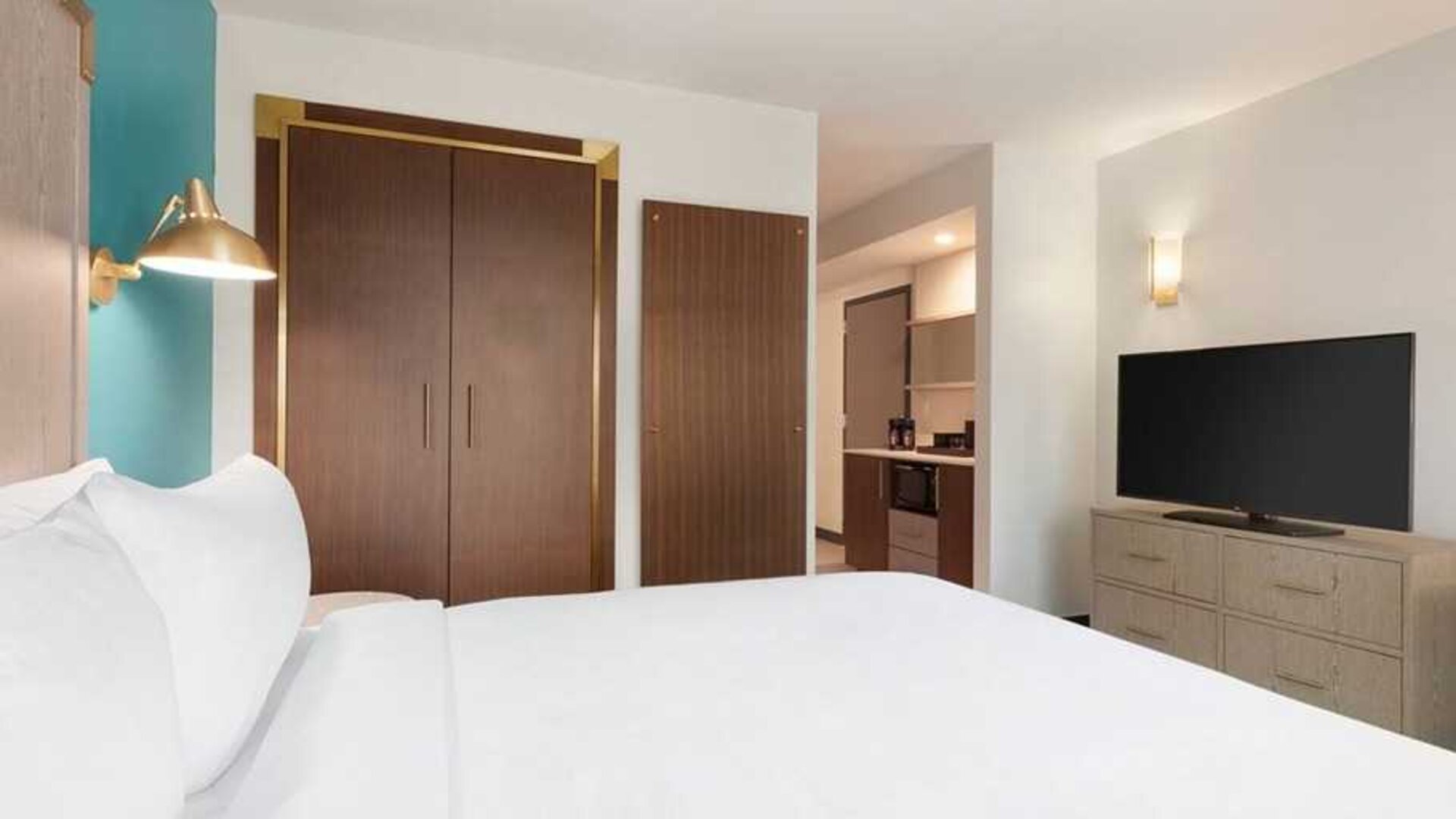 comfortable delux king room with TV at Embassy Suites by Hilton Boulder.